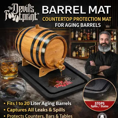 Devil’s Footprint Barrel Mat hero image showing oak aging barrel dripping whiskey onto waterproof spill tray that protects countertops from alcohol stains and leaks.