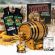 Small Batch Straight Bourbon Whiskey aging barrel kit with premium essence, glass of bourbon, corn and grain background, and Bootlegger’s Bible guide for home whiskey making.