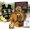 Apple Whiskey Making Kit with oak aging barrel, premium apple whiskey essence, Bootlegger’s Bible guide, fresh apples, cinnamon sticks, and whiskey glass for home infusion and aging.